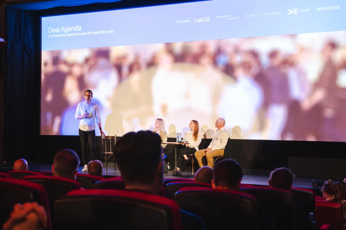 Lab08 and partner firms on stage at a Deal Agenda session
